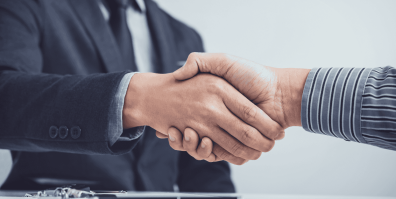 Grafika na której widać uściśnięte ręce